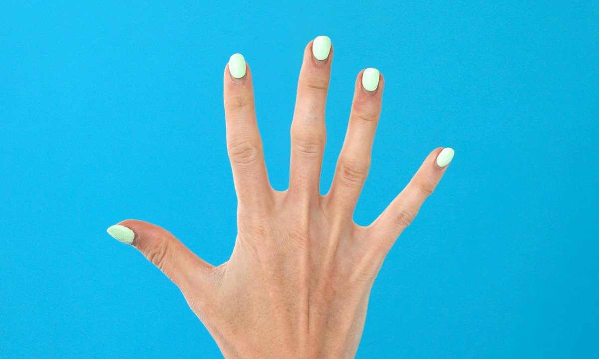 A photo of an outstretched hand with five fingers