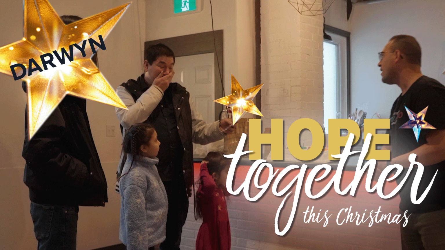 Darwyn and his family receiving the Hope Together for Christmas Blessing