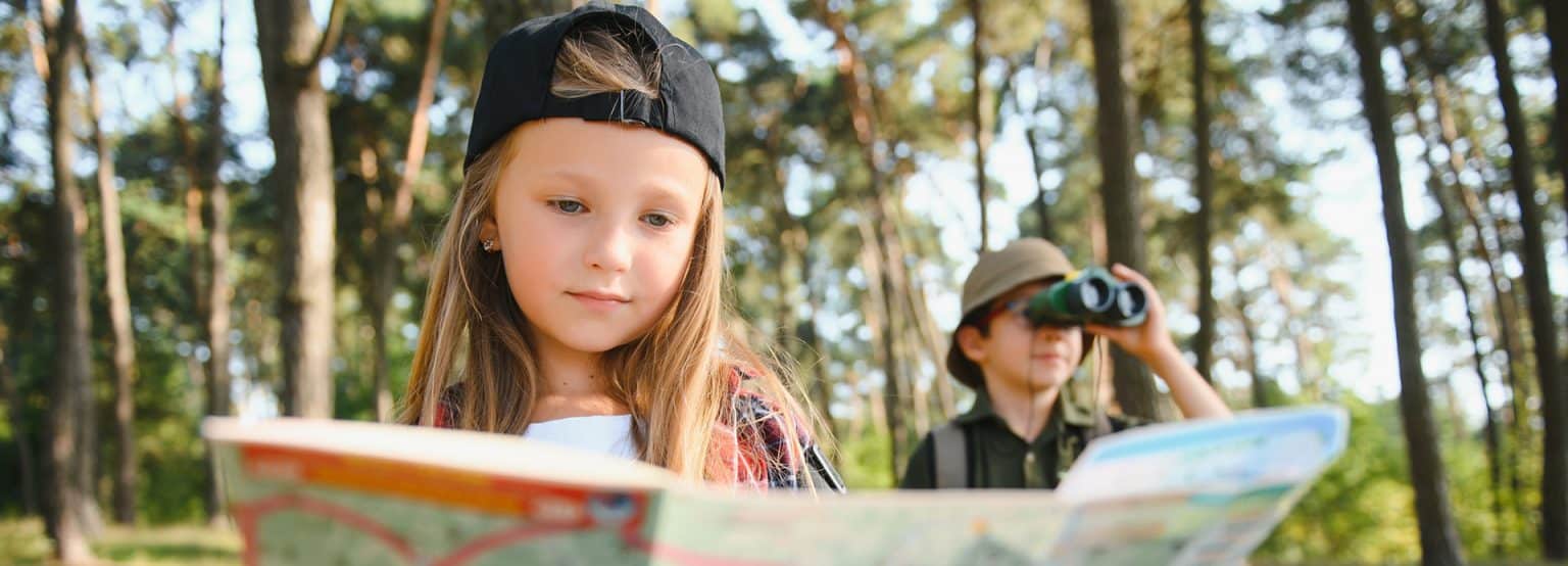 a young girl and her brother going for a nature walk in the woods