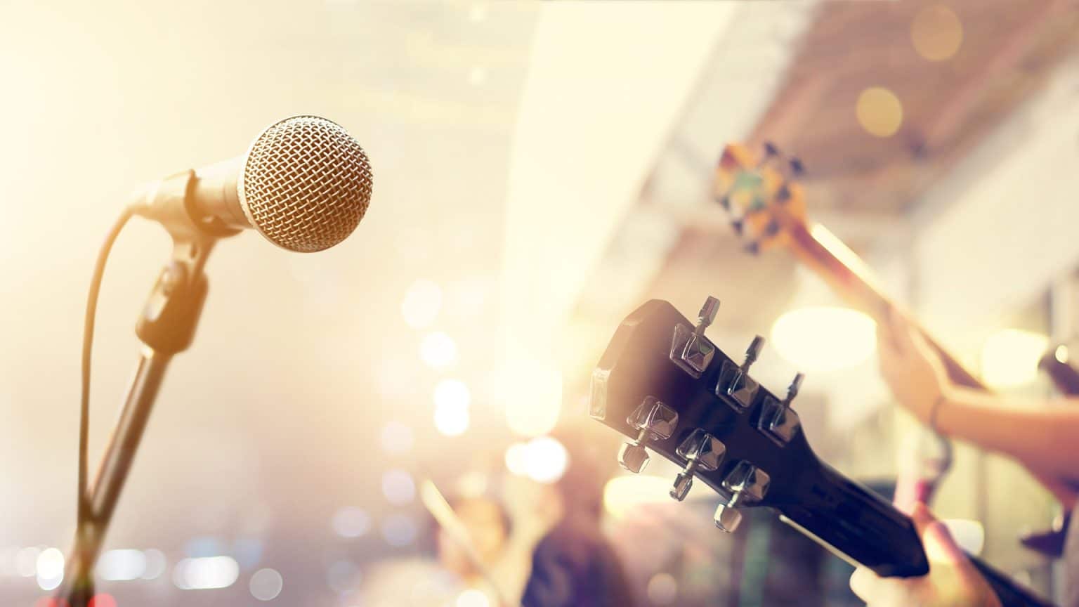 photo of microphone with guitars